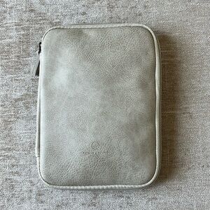 This is Ground beige zippered travel pouch